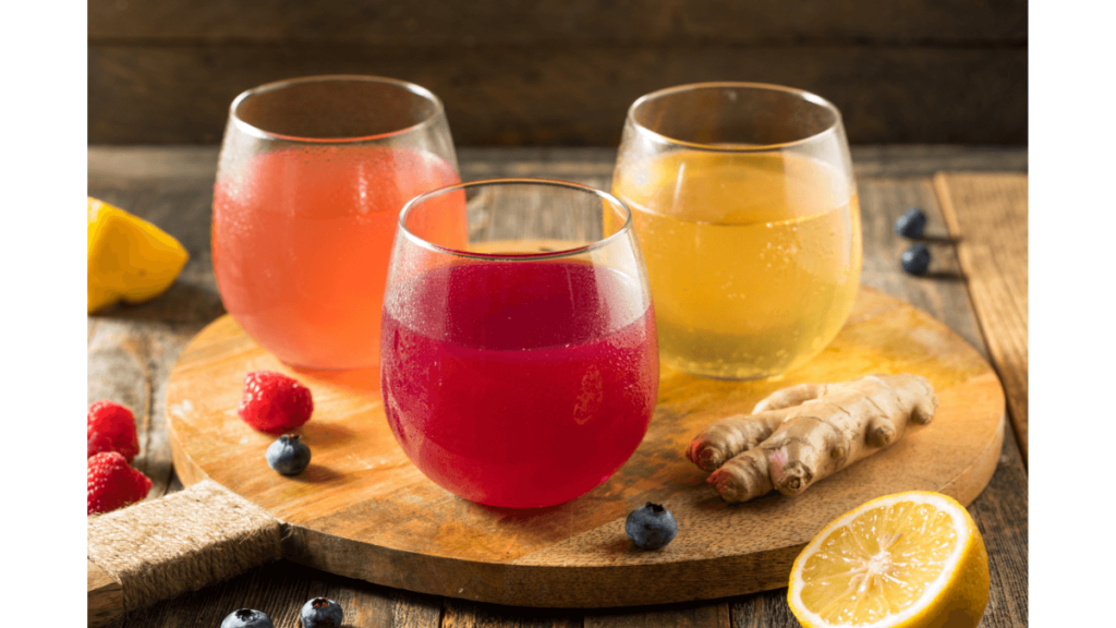 Three glasses of different flavored kombucha