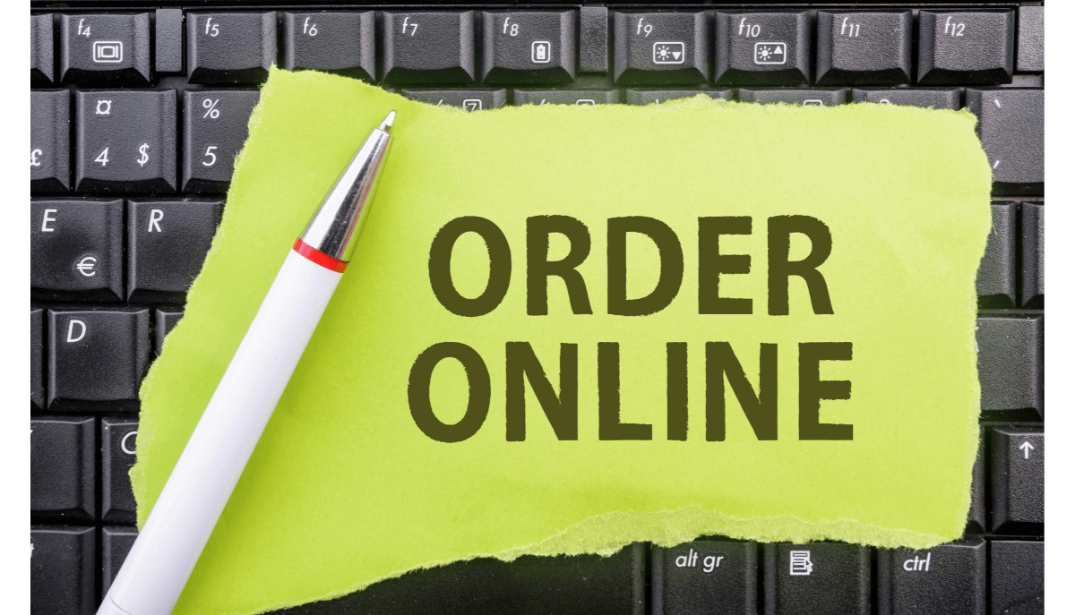 Order online written on paper on top of a computer keyboard