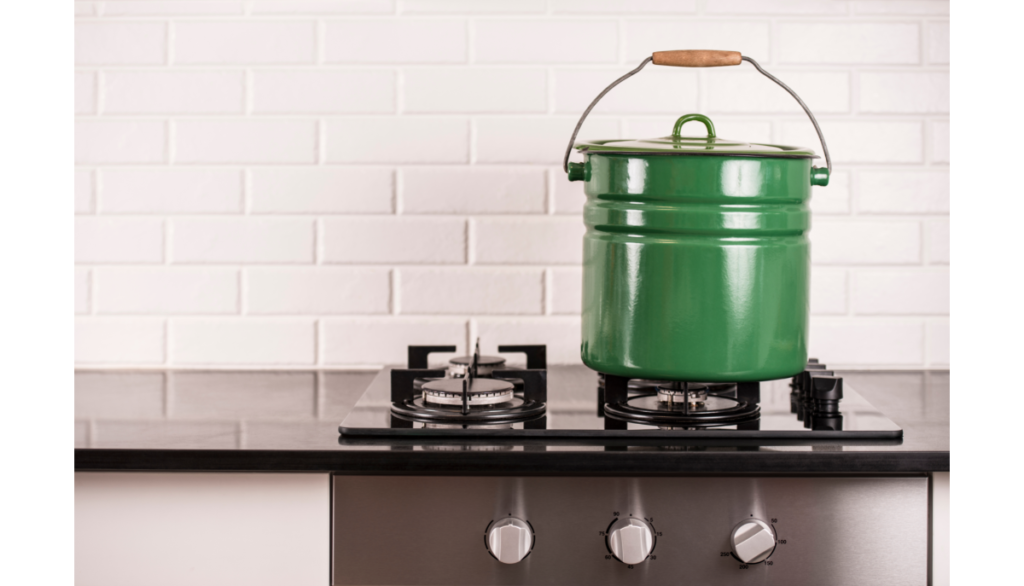 Green kettle on top of a stove